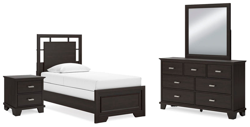 Ashley Furniture Covetown bedroom set with a stylish bed, dresser, and nightstands in a modern bedroom scene.