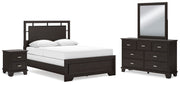 Ashley Furniture Covetown bedroom set including bed frame, nightstands, and dresser in a stylish bedroom arrangement.