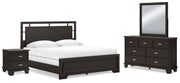 Ashley Furniture Covetown Bedroom Set with bed, dresser, and nightstands arranged in a stylish bedroom scene.