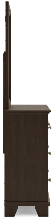 Ashley Furniture Covetown bedroom set with a queen-sized bed, dresser, and nightstands in a modern bedroom scene.
