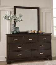 Ashley Furniture Covetown bedroom set with a bed, dresser, and nightstands in a modern design, shown in a stylish bedroom setting.