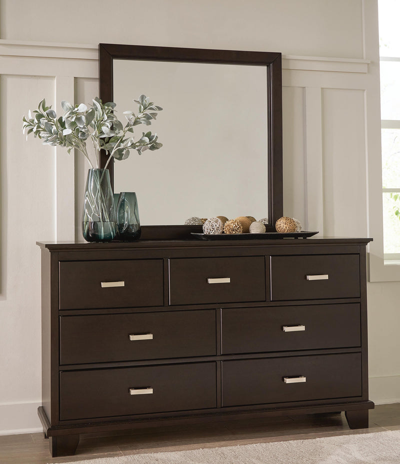 Ashley Furniture Covetown bedroom set with a bed, dresser, and nightstands in a modern design, shown in a stylish bedroom setting.