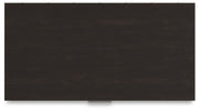 Ashley Furniture Covetown Chest of Drawers with a dark wood finish and sleek top surface, showcasing modern storage design.