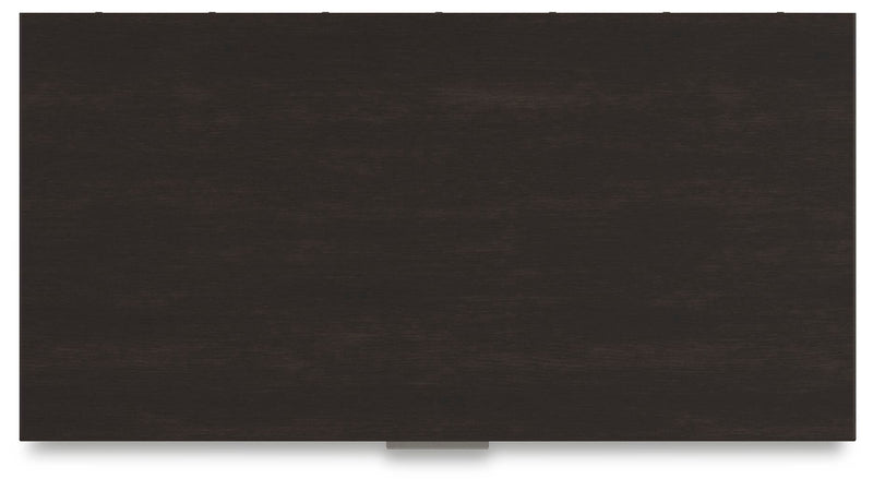 Ashley Furniture Covetown Chest of Drawers with a dark wood finish and sleek top surface, showcasing modern storage design.