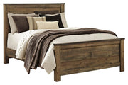 Ashley Furniture Trinell bedroom fireplace set featuring a cozy fireplace unit with decorative accents and warm wood finish.