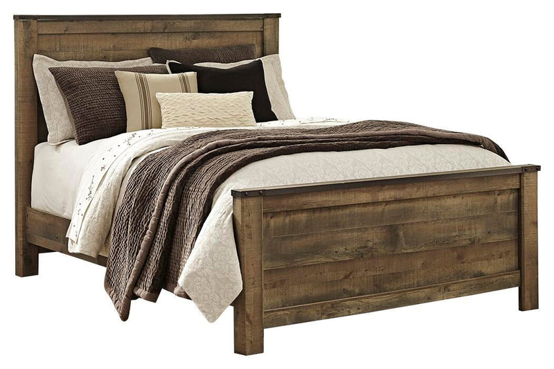 Ashley Furniture Trinell bedroom fireplace set featuring a cozy fireplace unit with decorative accents and warm wood finish.
