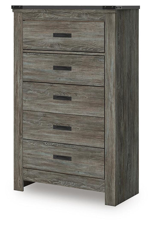 Ashley Furniture Frandern chest of drawers, angled view showing wooden finish and multiple drawer handles in a modern bedroom setting.