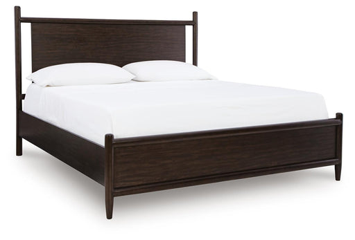 Ashley Furniture Dantenton Bed with a classic wooden frame and elegant design, shown from a side angle.