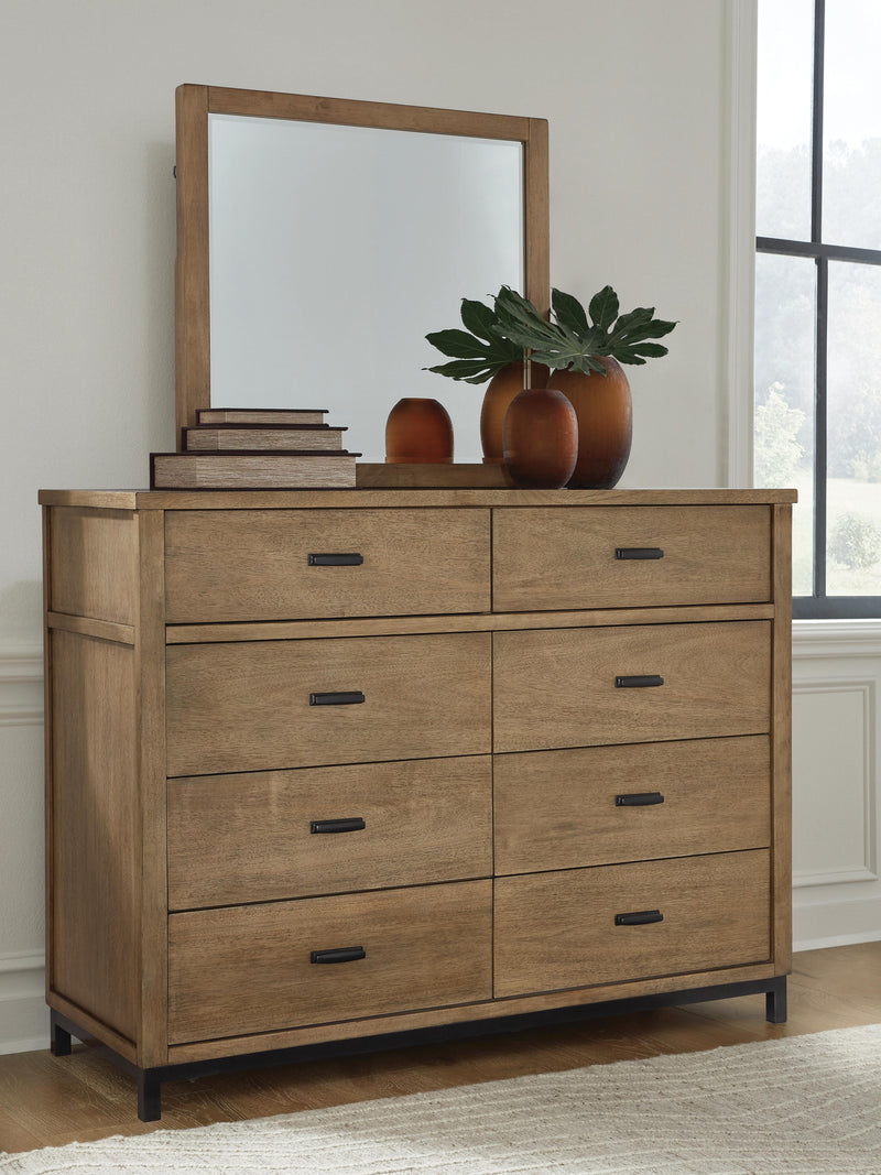Ashley Furniture Tomtyn dresser and mirror set with a sleek wooden finish, featuring a spacious dresser with multiple drawers and a matching mirror.