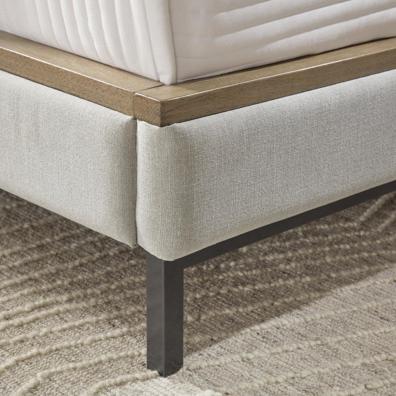 Ashley Furniture Tomtyn upholstered bed with a plush fabric headboard and elegant design, shown in a detailed view.