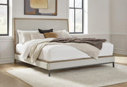 Ashley Furniture Tomtyn upholstered bed with plush fabric and modern design, shown in a stylish bedroom setting.
