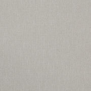 Ashley Furniture Tomtyn upholstered bed with a padded headboard and neutral fabric, showcasing a modern bedroom design.