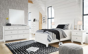 Ashley Furniture Fortman bedroom set with a bed, nightstands, and dresser in a modern design, featuring wood finish and contemporary style.