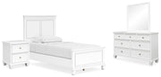Ashley Furniture Fortman bedroom set with a modern bed frame, dresser, and nightstands in a stylish bedroom interior.