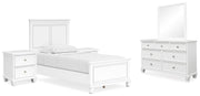 Ashley Furniture Fortman bedroom set with a bed, matching nightstands, and dresser in a modern bedroom setup.