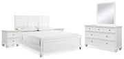 Ashley Furniture Fortman bedroom set with a modern bed frame, matching nightstands, and a stylish dresser in a contemporary bedroom.