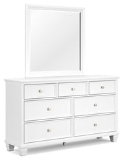 Ashley Furniture Fortman bedroom set with a stylish bed, matching nightstands, and a coordinated dresser in a modern bedroom design.