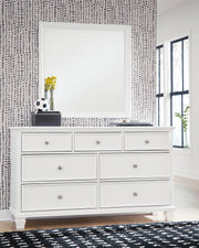 Ashley Furniture Fortman dresser and mirror set featuring a sleek wood finish and modern design with a matching mirror.