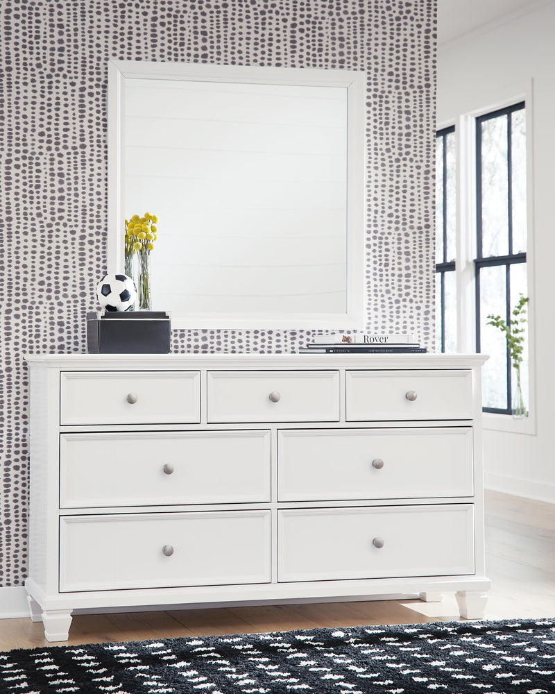 Ashley Furniture Fortman dresser and mirror set featuring a sleek wood finish and modern design with a matching mirror.
