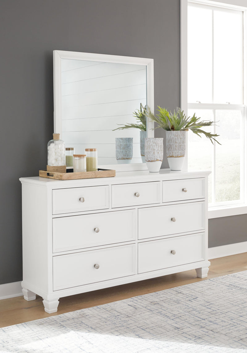 Ashley Furniture Fortman bedroom set with a modern bed frame, matching nightstands, and dresser in a stylish bedroom layout.