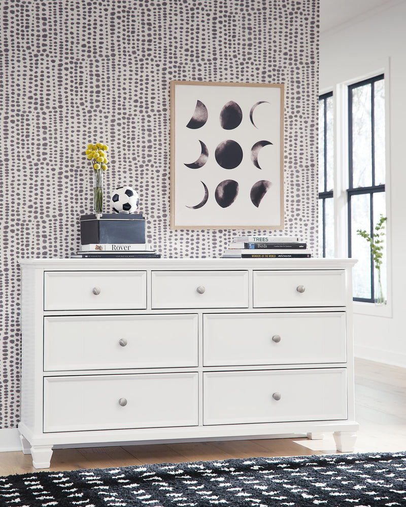 Ashley Furniture Fortman dresser with multiple drawers, dark wood finish, and modern design, ideal for bedroom storage.