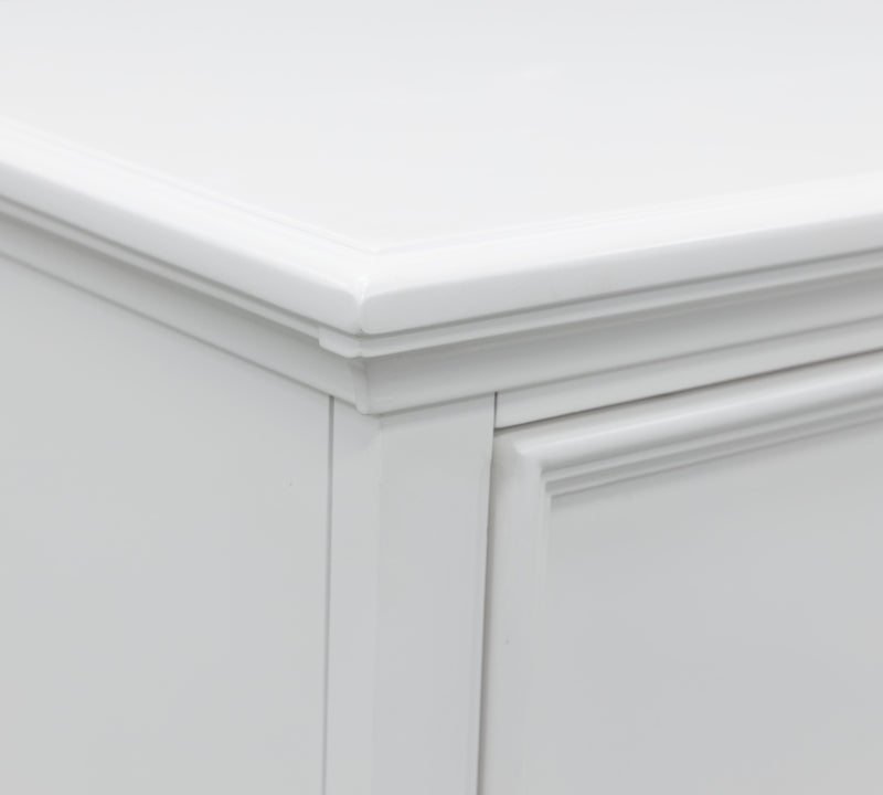 Ashley Furniture Fortman chest of drawers with detailed wood finish and multiple drawers for storage.