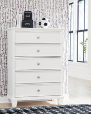 Ashley Furniture Fortman chest of drawers, wooden bedroom storage unit with multiple drawers, in a modern design.