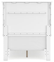 Ashley Furniture Fortman bedroom set with a bed frame, matching nightstands, and a dresser in a modern bedroom setting.