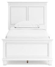 Ashley Furniture Fortman bedroom set featuring a bed with a upholstered headboard and matching bedroom furniture.