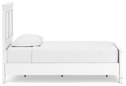 Ashley Furniture Fortman bedroom set with a modern bed frame and matching nightstands in a stylish bedroom setup.