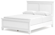 Ashley Furniture Fortman Bed with upholstered headboard and wooden frame, shown from an angled view.
