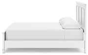 Ashley Furniture Fortman Bed with a dark wood finish and elegant headboard, shown from a side view.