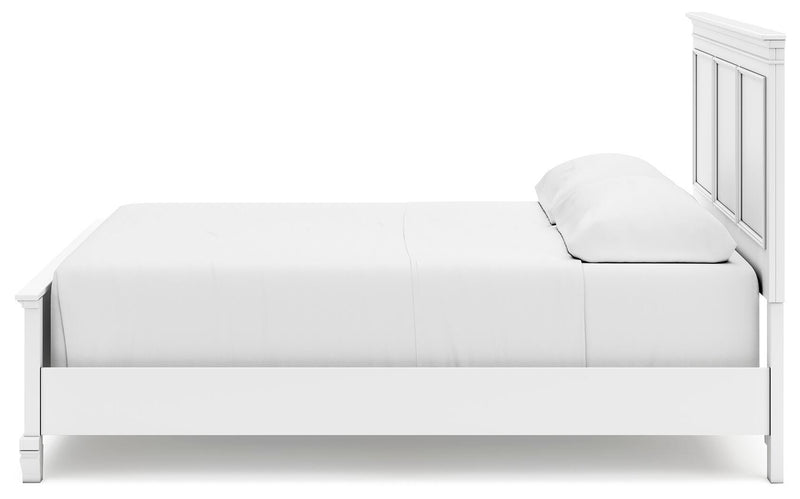 Ashley Furniture Fortman Bed with a dark wood finish and elegant headboard, shown from a side view.