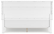 Ashley Furniture Fortman Bed with headboard and wooden frame, shown from the back in a well-lit bedroom setting.