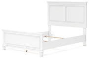 Ashley Furniture Fortman bedroom set with a bed, nightstands, and dresser in a modern bedroom arrangement.