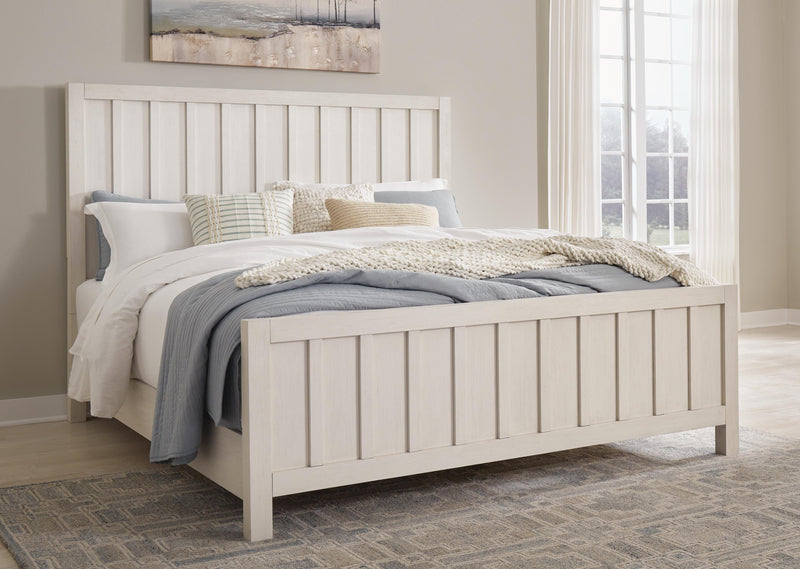 Ashley Furniture Shaybrock Bed with a dark wood frame and upholstered headboard, shown in a modern bedroom setting.