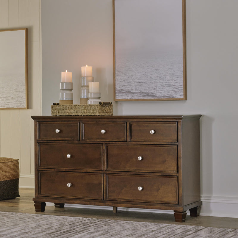 Ashley Furniture Danabrin dresser with multiple drawers, dark wood finish, and modern design for bedroom storage.