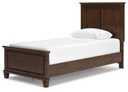 Ashley Furniture Danabrin Bed featuring a modern wooden frame with a sleek headboard and stylish finish.