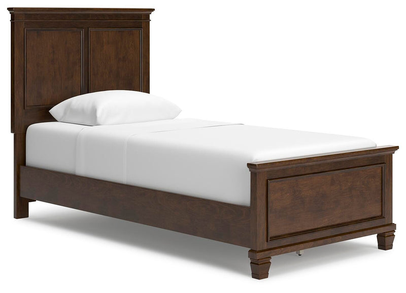 Ashley Furniture Danabrin Bed with a stylish upholstered headboard and dark wood frame, shown from a side angle.