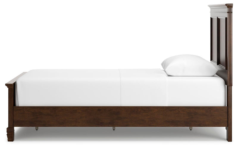 Ashley Furniture Danabrin Bed with a sleek wooden frame and side panel in a modern bedroom setting.
