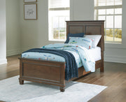 Ashley Furniture Danabrin Bed with a modern wooden frame and headboard, showcasing a stylish bedroom furniture piece.