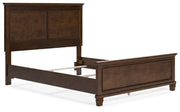 Ashley Furniture Danabrin Bed in a neutral-toned bedroom with a stylish headboard and modern design featuring clean lines.