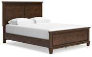 Ashley Furniture Danabrin Bed with a stylish headboard and frame, shown from an angled view in a bedroom setting.
