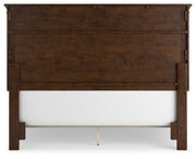 Ashley Furniture Danabrin Bed with a sturdy wooden frame and classic design, shown from the back in a well-lit bedroom setting.