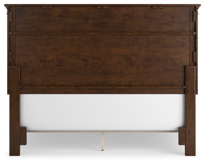 Ashley Furniture Danabrin Bed with a sturdy wooden frame and classic design, shown from the back in a well-lit bedroom setting.