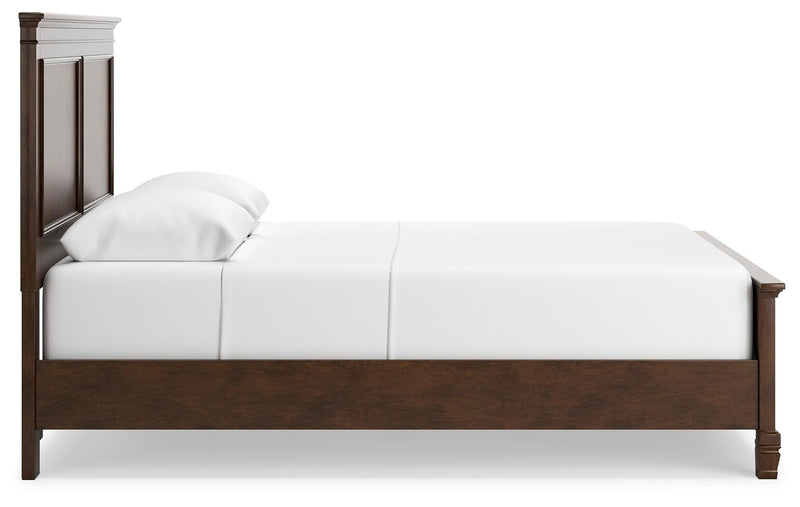 Ashley Furniture Danabrin Bed with wooden frame and neutral fabric upholstery, shown from a side view.
