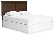 Ashley Furniture Danabrin panel storage bed with a sleek wood finish and built-in storage drawers, angled view showing headboard and foot.
