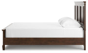 Ashley Furniture Danabrin Bed with a sleek wooden frame and side view, showcasing its modern design and rich finish.