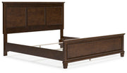 Ashley Furniture Danabrin Bed with upholstered headboard and wooden frame, shown from an angled view.