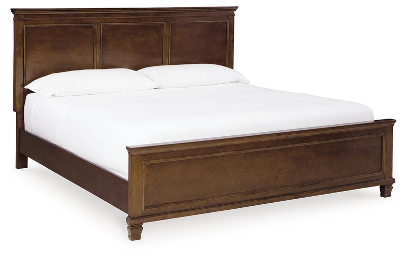 Ashley Furniture Danabrin Bed with a stylish wooden frame and upholstered headboard in a modern bedroom setting.